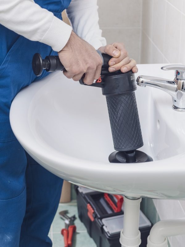 professional-plumber-unclogging-a-sink-2021-09-02-16-30-58-utc